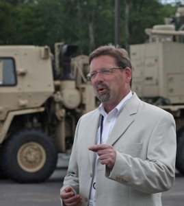 Chris Marzilli, president of General Dynamics C4 Systems, in front of WIN-T node (Credit: General Dynamics)